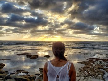 Scenic view of sea against cloudy sky