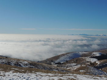 Scenic view of snowcapped mountains against sky