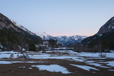 Snow covered mountains against clear sky