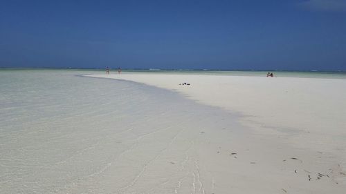 Scenic view of beach against clear sky