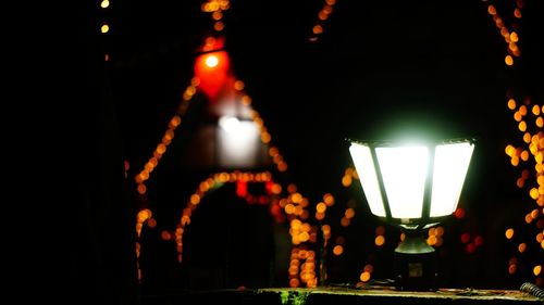 Illuminated lanterns hanging at night