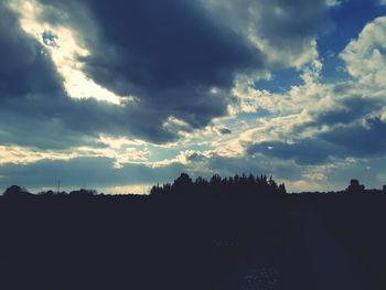 Silhouette landscape against sky during sunset