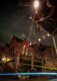 Low angle view of illuminated building at night