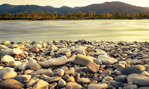 Rocks on shore by lake