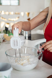 Midsection of woman preparing food