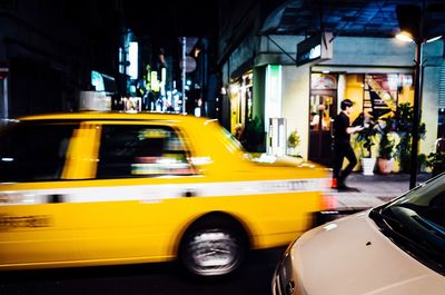 Yellow car on street in city