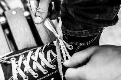 Midsection of woman working with rope