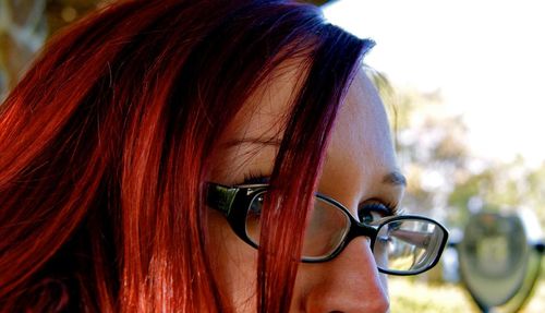 Close-up of redheaded woman wearing eyeglasses