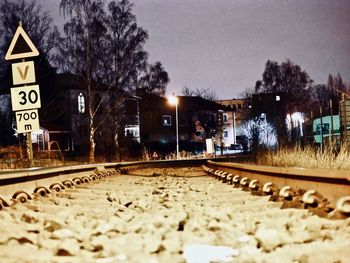Surface level of train on railroad tracks against sky