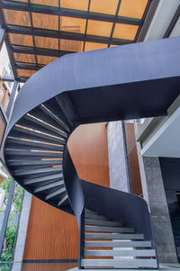 Low angle view of spiral staircase in building