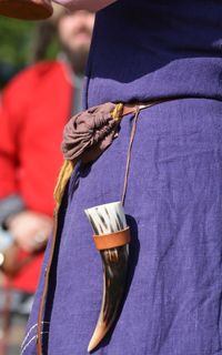 Rear view of person holding umbrella