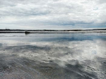 Scenic view of beach against sky