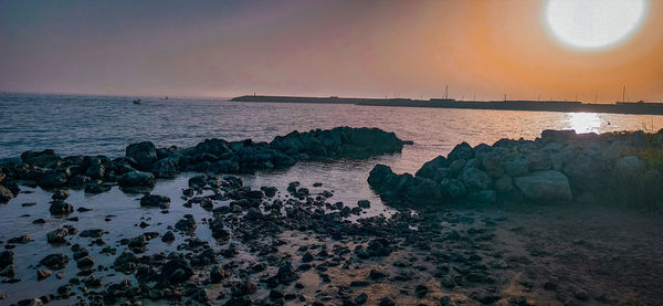 Scenic view of sea against sky during sunset