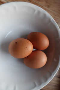 High angle view of eggs in bowl on table