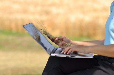 Close-up of man using mobile phone