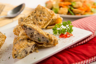 Close-up of fish served in plate on table