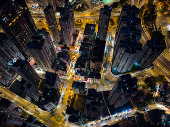 High angle view of illuminated buildings in city at night