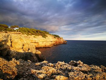 Scenic view of sea against cloudy sky