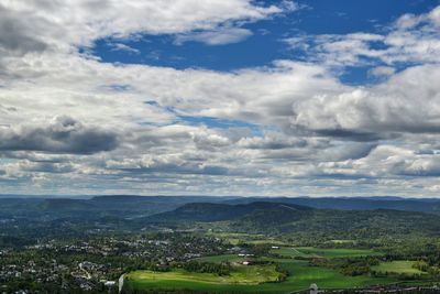 Scenic view of mountains against cloudy sky