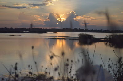 Scenic view of lake against sky during sunset