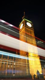 Low angle view of illuminated building at night