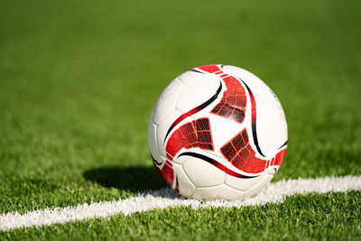 Close-up of soccer ball on field