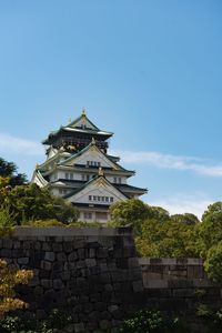 Low angle view of temple against blue sky