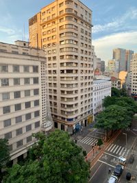 Buildings in city against sky