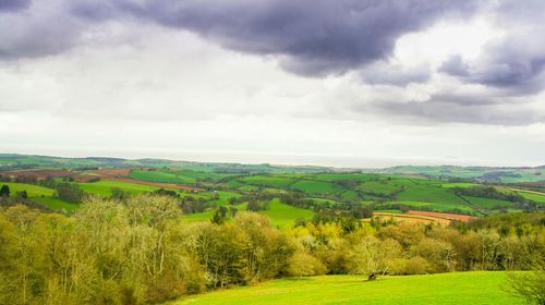 Scenic view of landscape against cloudy sky