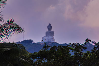 Low angle view of statue against sky