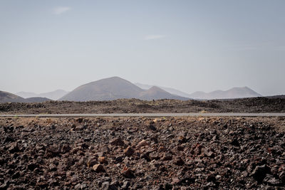 View of volcanic landscape against sky