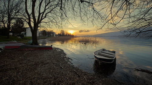 Scenic view of lake against sky during sunset