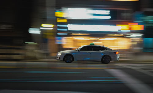 Blurred motion of car on street