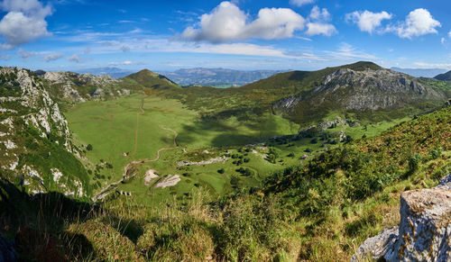 Scenic view of landscape and mountains against sky