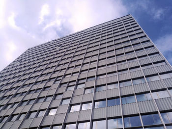 A big office building facade view from bottom