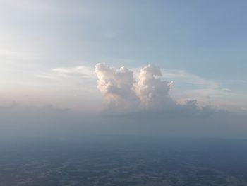 Aerial view of clouds over landscape against sky