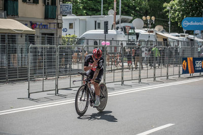 People riding bicycle on road