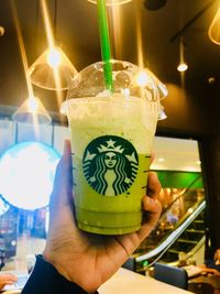 Close-up of hand holding drink