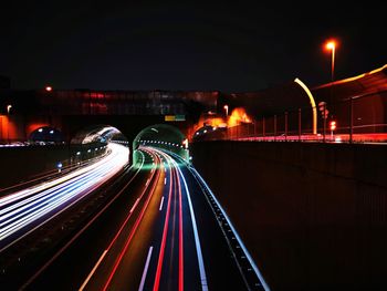 High angle view of light trails on road at night