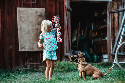 Full length of woman with dog