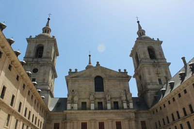 Low angle view of bell tower against sky