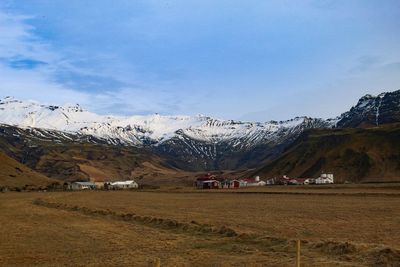 Scenic view of snowcapped mountains against sky