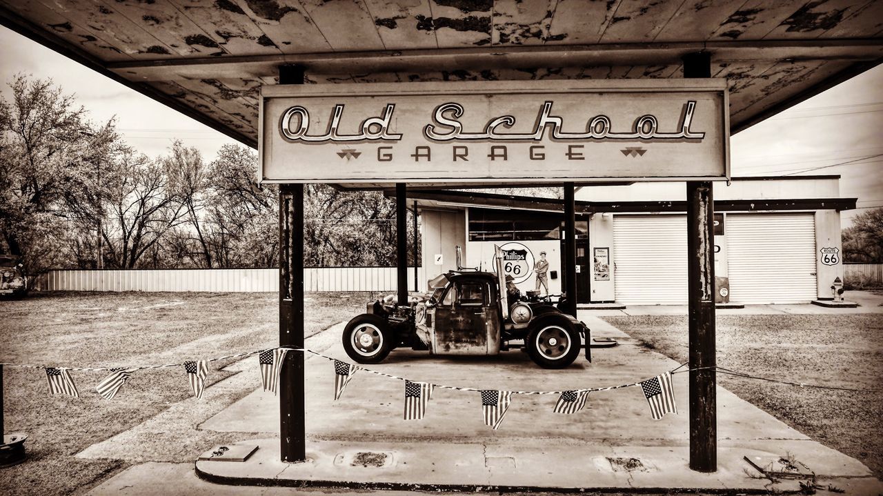 transportation, communication, land vehicle, day, fuel pump, gas station, built structure, outdoors, no people, architecture, sky, tree