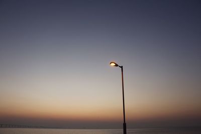 Scenic view of sea against clear sky during sunset
