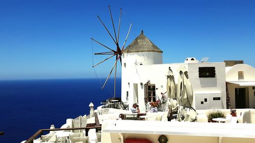 Built structures against calm blue sea