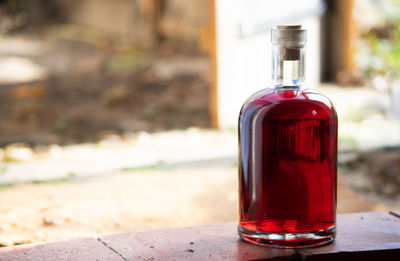 Close-up of red wine glass on table