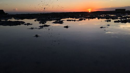 View of calm sea at sunset