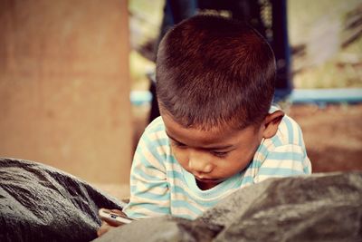 Close-up portrait of boy looking away