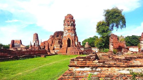 Old temple against cloudy sky