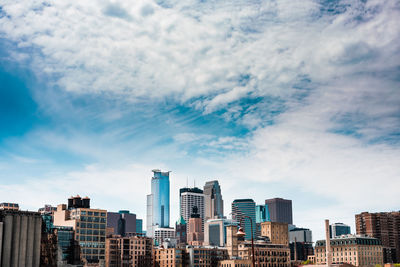 Buildings in city against sky